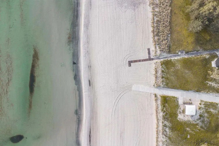Aerial view of a natural beach symbolizing sustainability at Private Palace Hotels & Resorts