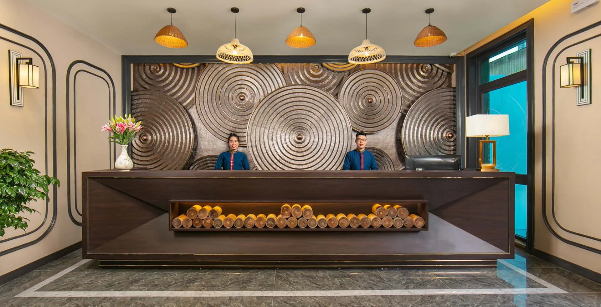 Reception area at Delasol Phat Linh Hotel with large front desk
